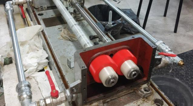FZG test rig with mounted 3D-printed spur gears used for wear validation