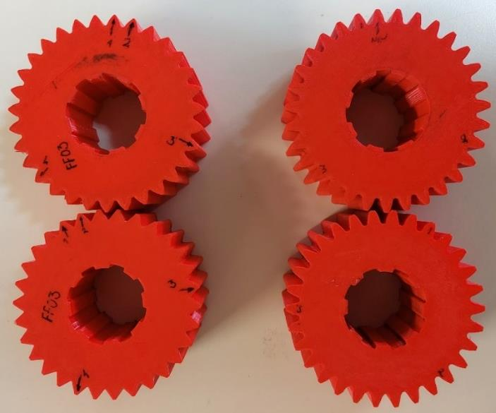 Optimized free-form and standard involute 3D-printed spur gear specimens produced by FDM