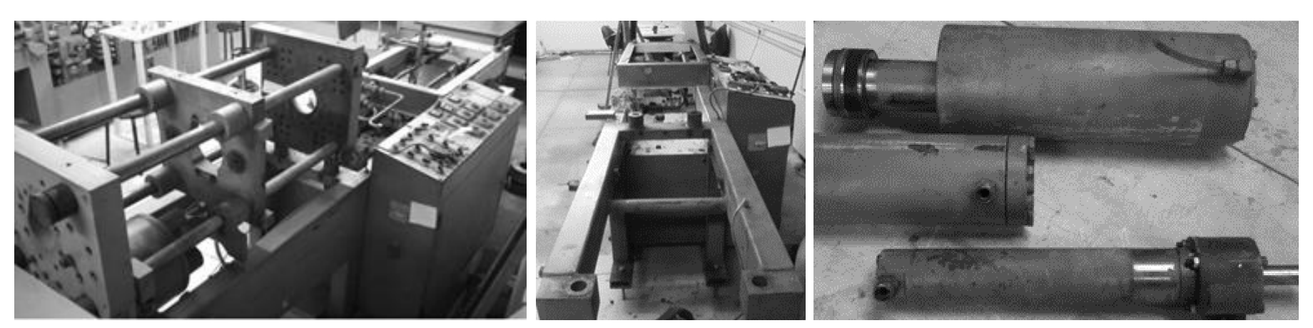 Recovered FROMAG injection moulding machine chassis and hydraulic actuators before conversion into a laboratory bench