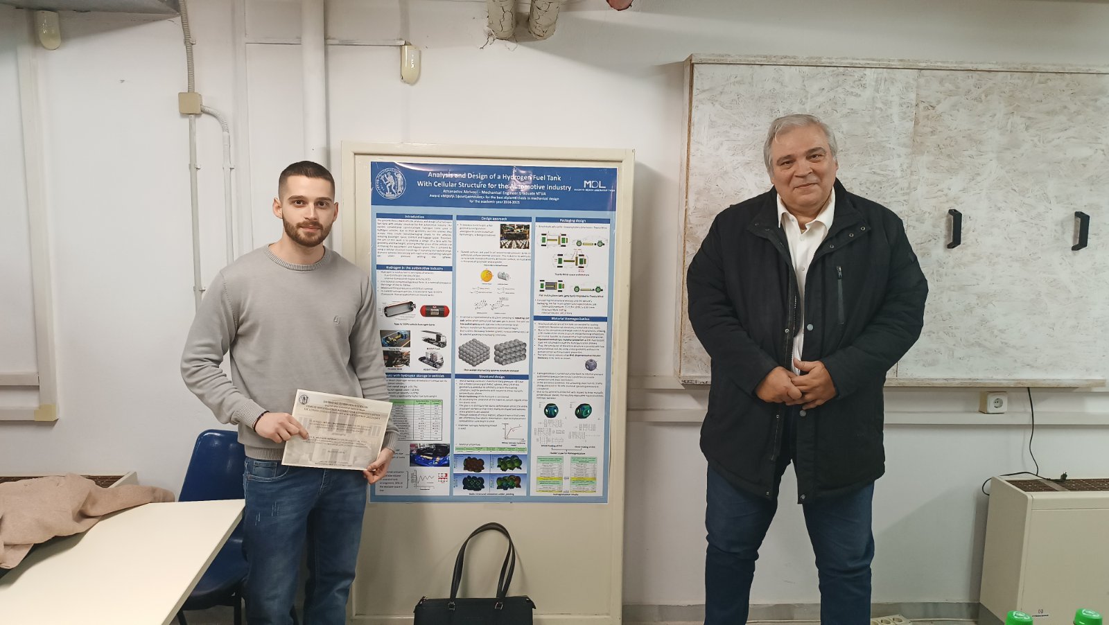 Athanasios Akrivosi with the awarded thesis poster during the ceremony