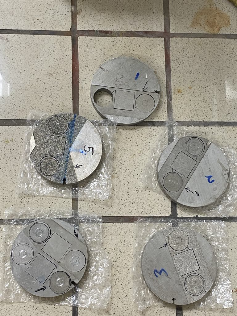 Manufactured WETSURF metallic specimens with different macro-texture layouts